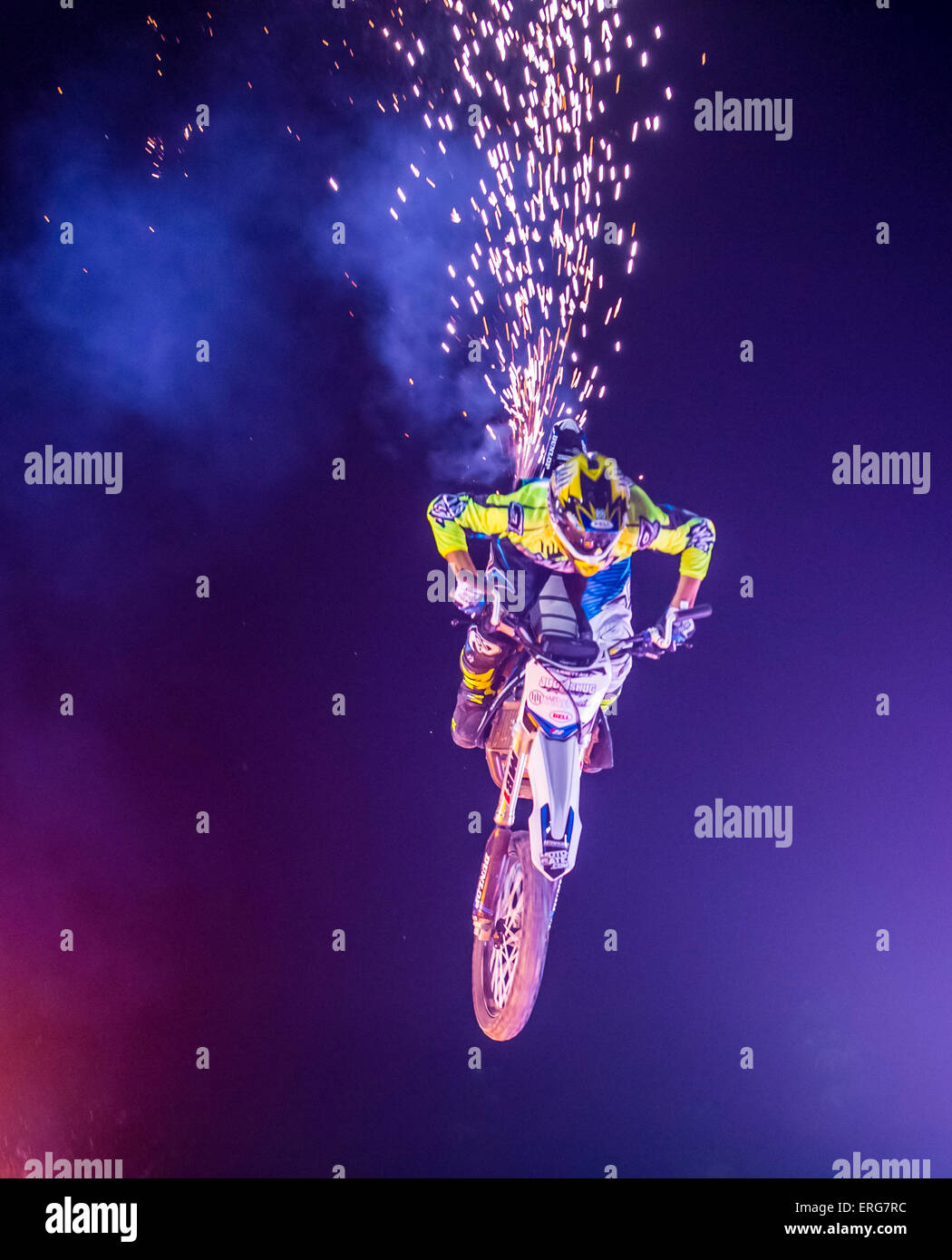 unidentified rider giving FMX motocross demonstration as part of the