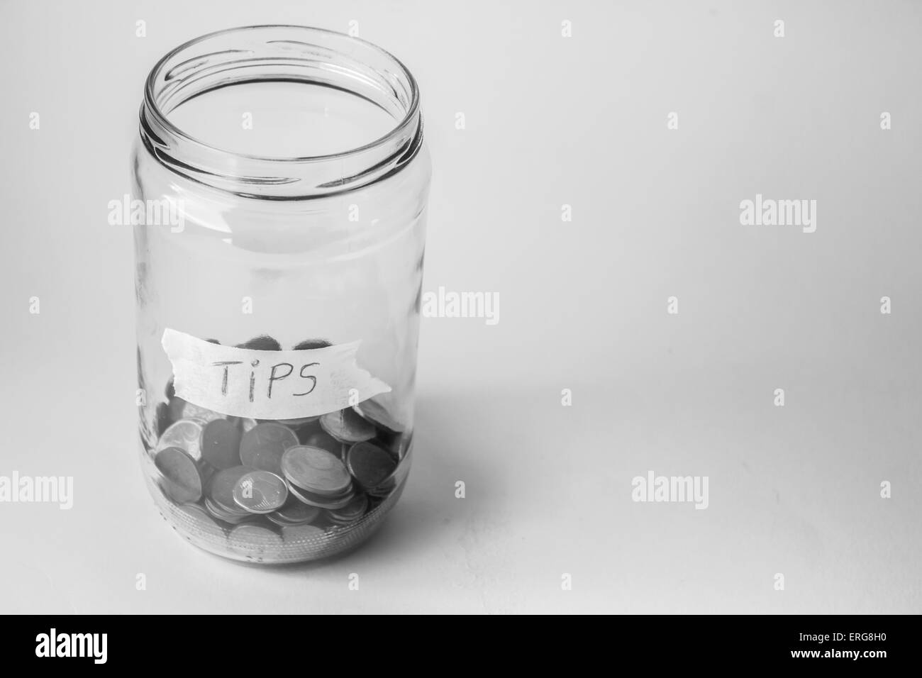 Jar for tips with euro cents coins. Stock Photo