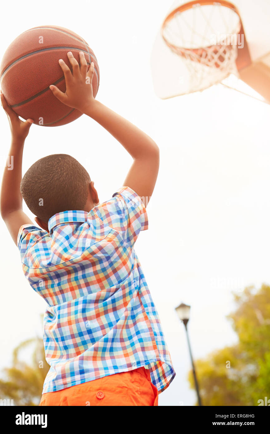 Boy On Basketball Court Shooting For Basket Stock Photo Alamy