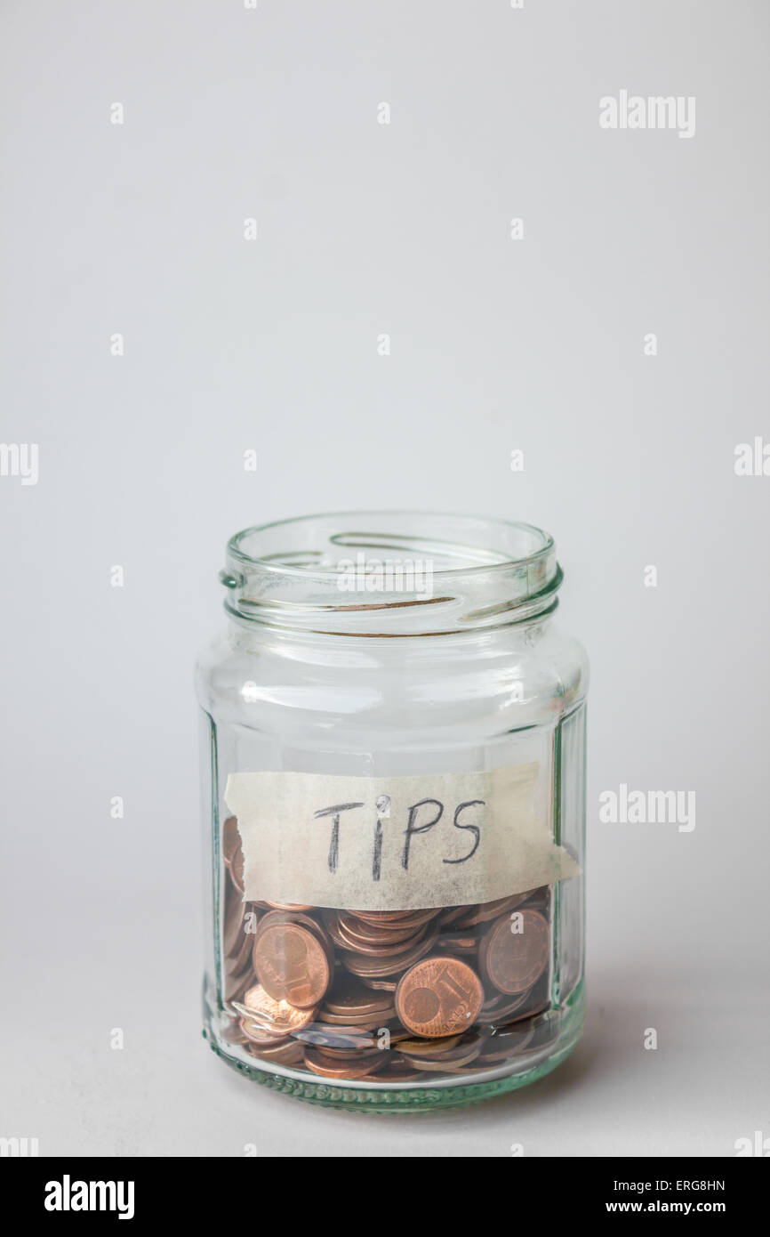 Jar for tips with euro cents coins. Stock Photo