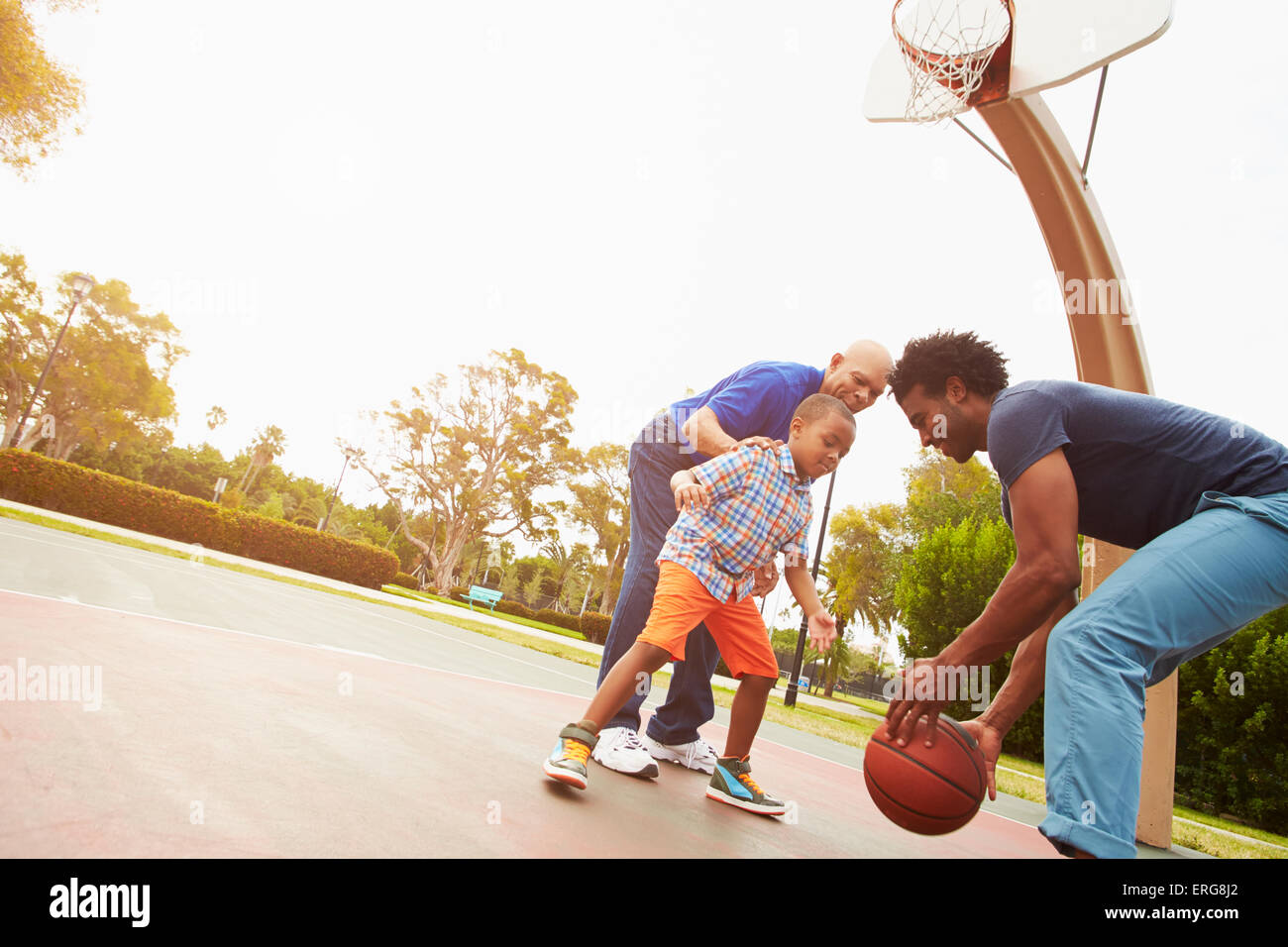 Grandfather With Son And Grandson Playing Basketball Stock Photo Alamy