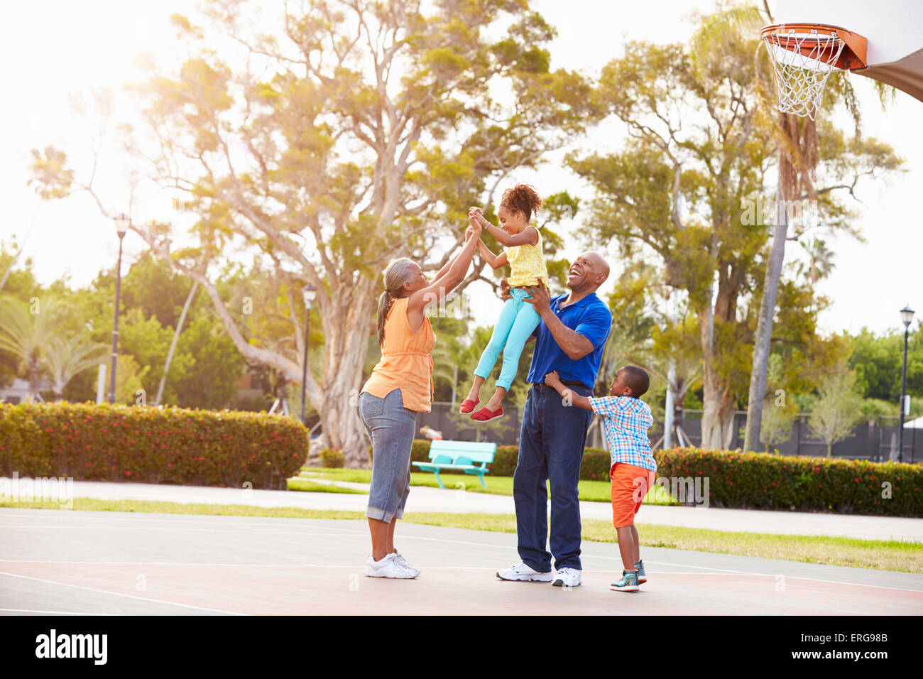 Grandparents And Grandchildren Playing Basketball Together Stock Photo ...