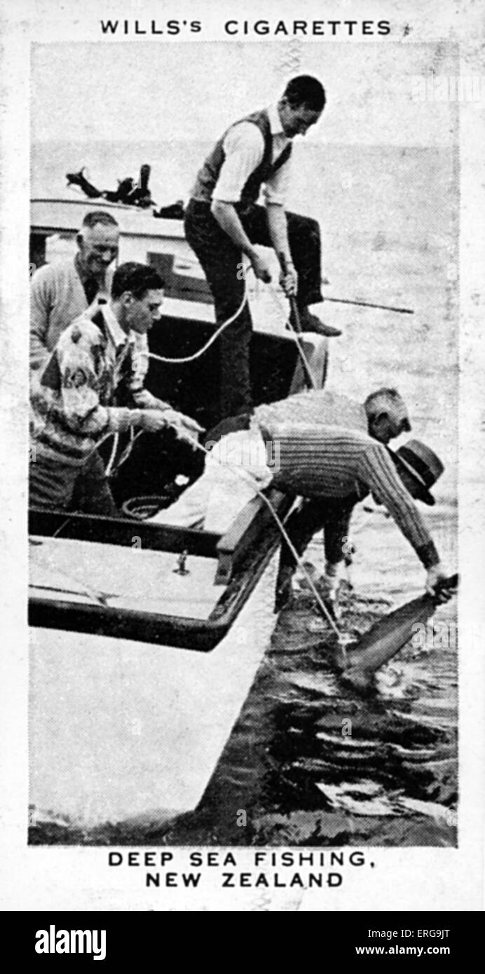 King George VI (then Duke of York) deep-sea fishing in the Bay of Islands, New Zealand, 1927. From commemorative coronation Stock Photo