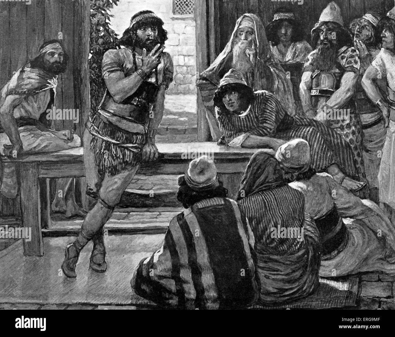 Samson puts forth a riddle by J James Tissot. Illustration to Book of Judges, 14.12 : 'And Samson said unto them, I will now put forth a riddle unto you: if ye can certainly declare it me within seven days of the feast, and find it out, then I will give you thirty sheets and thirty change of garments'. JT: French painter, 15 October 1836 – 8 August 1902 Stock Photo