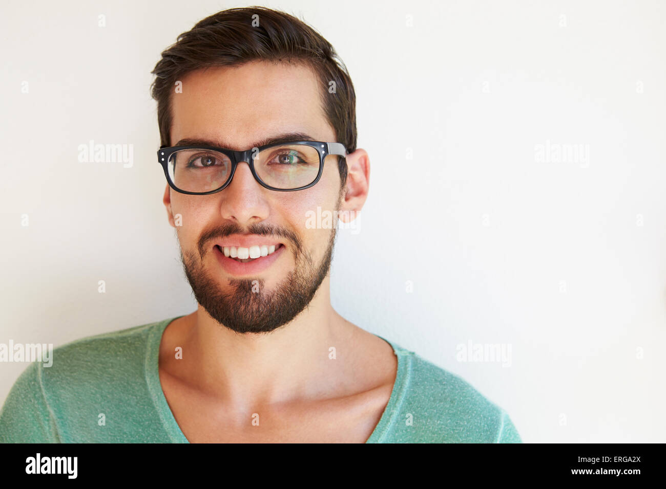 Portrait Of Young Man Standing Outdoors Against White Wall Stock Photo ...