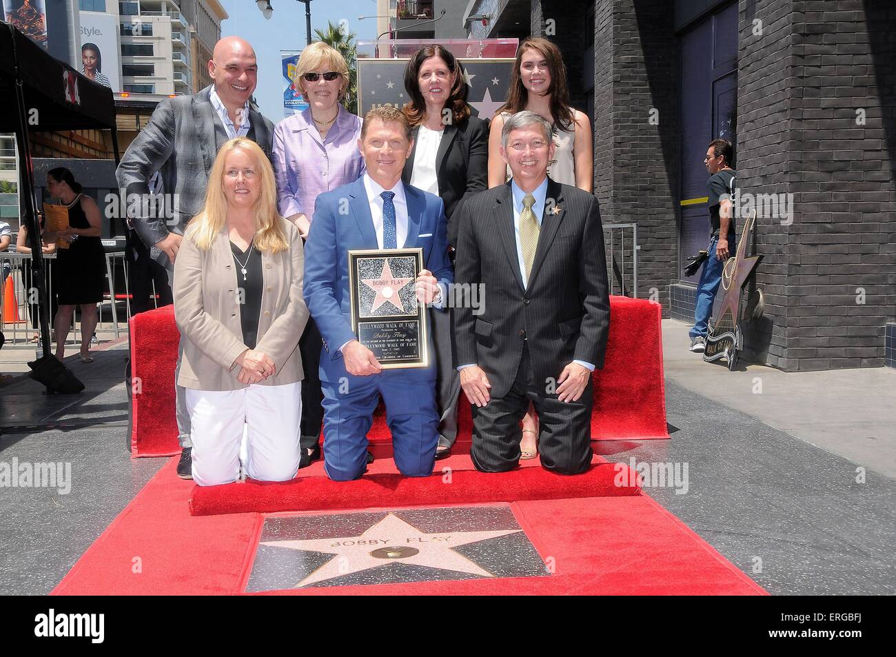 Los Angeles, CA, USA. 2nd June, 2015. Michael Symon, Beth Marlis, Brooke Johnson, Bobby Flay, Maureen Schultz, Leron Gubler, Sophie Flay at the induction ceremony for Star on the Hollywood Walk of Fame for Bobby Flay, Hollywood Boulevard, Los Angeles, CA June 2, 2015. Credit:  Michael Germana/Everett Collection/Alamy Live News Stock Photo