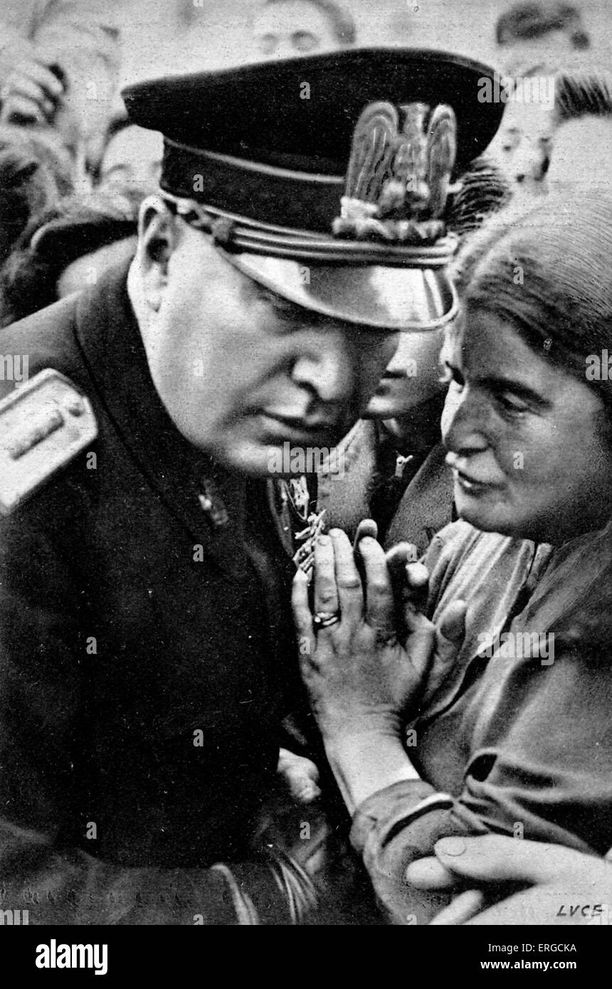 Benito Mussolini listening to woman - portrait. 40th Prime Minister of Italy and leader of National Fascist Party: 29 July 1883 Stock Photo