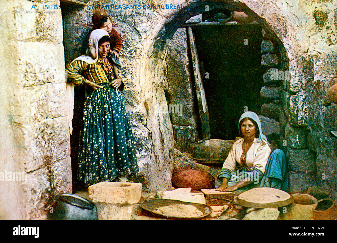 Syria. Syrian female peasants making pita bread -  early 20th century postcard. Stock Photo