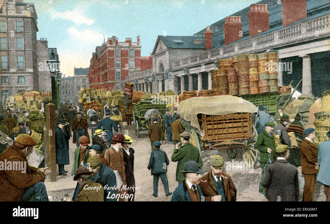 Covent Garden Market, London. Shows cartloads of food produce being supervised. Stock Photo