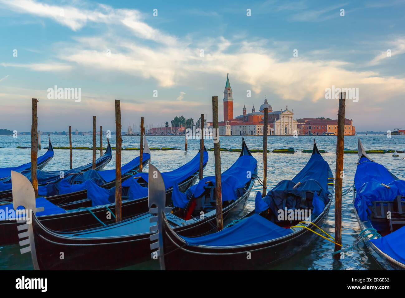 Gondolas at twilight in Venice lagoon, Italia Stock Photo