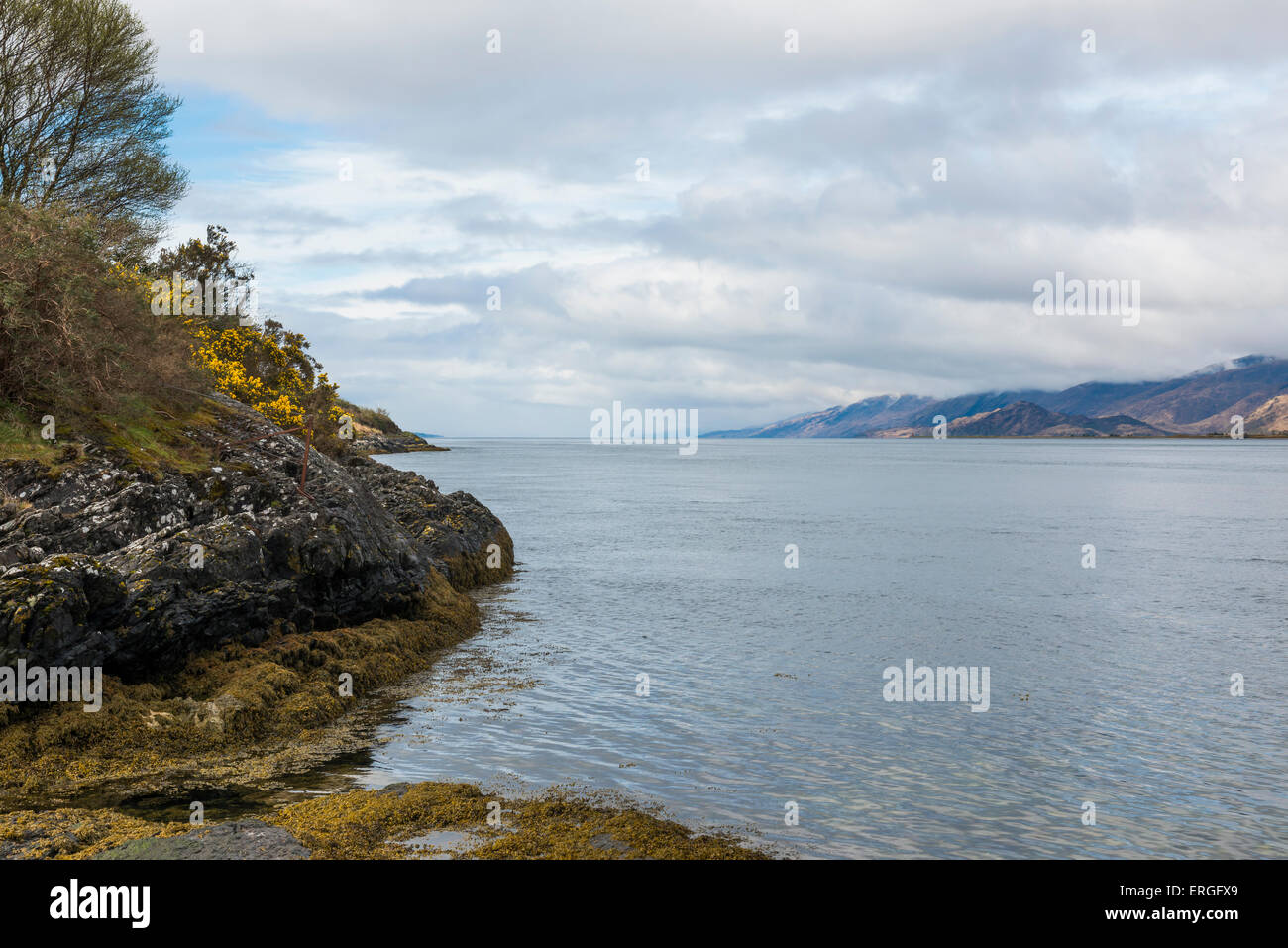 Sea with rocks and clouds at Ardcour and Incree in Scotland. Stock Photo