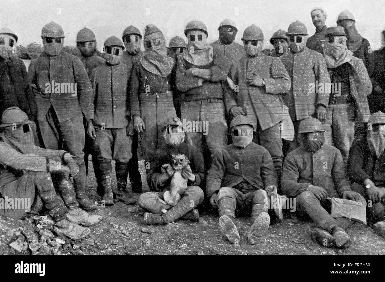 French soldiers with dog wearing gas masks during gas mask parade in trench, Western Front, World War 1. 1916. Stock Photo