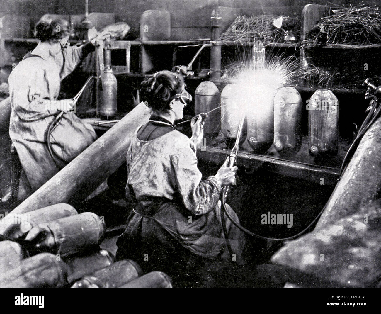 French women working in munitions factory during World War 1. April 1916. Finishing shell cases. Stock Photo