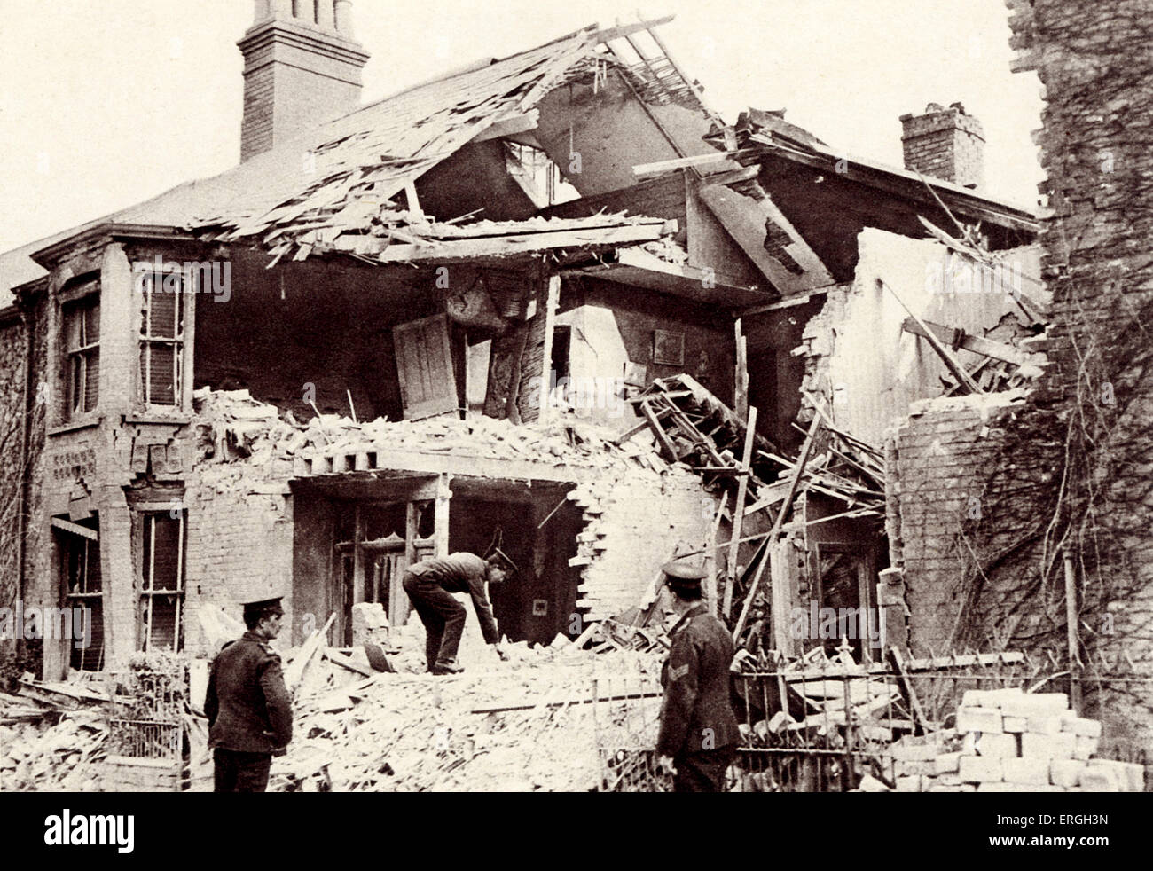 House destroyed by German bombing during World War 1. 1916. Lowestoft, Suffolk, UK. Two women and special constable were Stock Photo