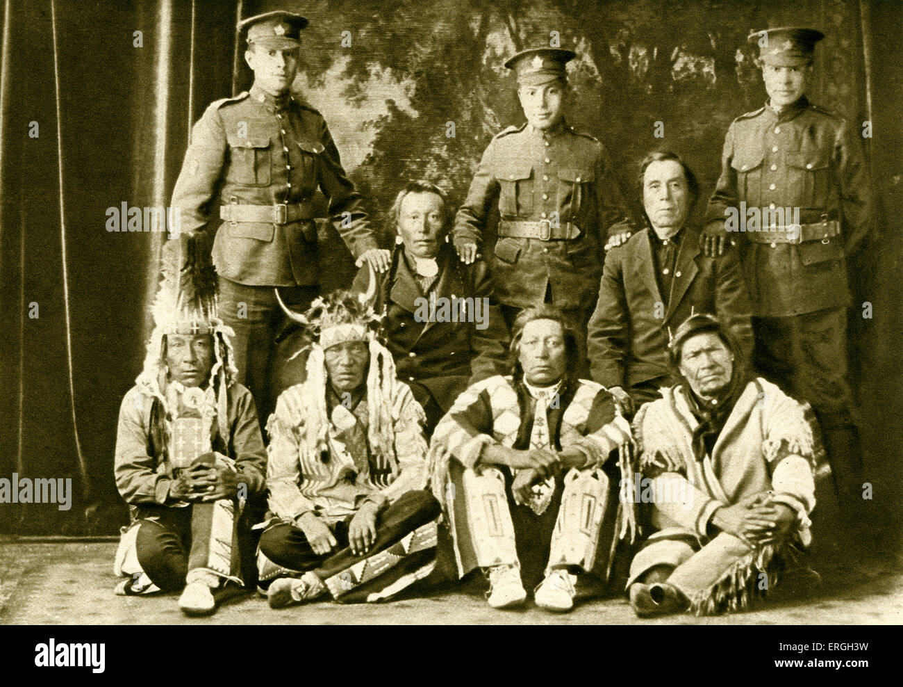 Cree First Nations Canadians during World War 1. Three generations with grandsons in army uniform. 1916. Saskatchewan, Canada. Stock Photo