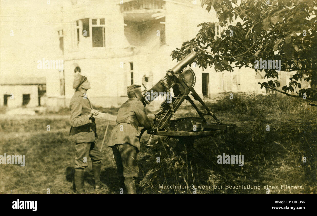 World War 1: German anti- aircraft machine gun shooting down an enemy plane. German postcard. German army fighting on side of Stock Photo