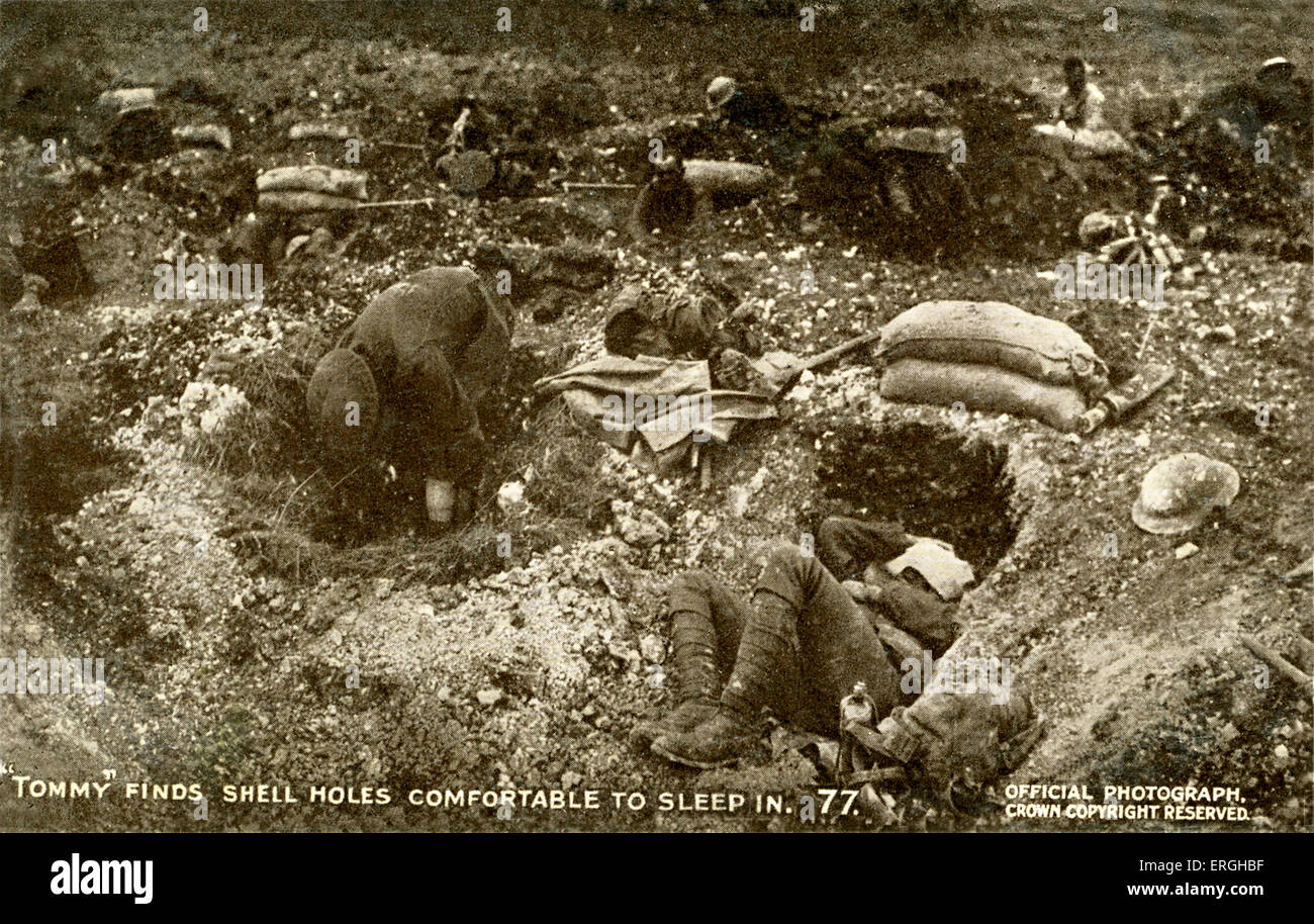 World War 1: British soldiers sleeping in shell holes. British Offical War Photograph, published on postcard. Series 10, No. 77. Caption: ' 'Tommy' find shell holes comfortable to sleep in./ One of the queer results of the British shellfire is to provide comfortable holes in which 'Tommy' can take a nap after he has captured the ground'. Tommy, colloquial term for British private. Stock Photo
