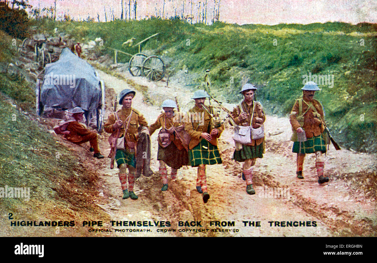 World War 1: Highlanders piping themselves back from the trenches. British Official War Photograph. Series 1. No 2. Published on postcard. Caption on reverse: 'Our gallant Highlanders, who love to charge the enemy to the skirl of the pipes, are fond of playing their national music in lighter mood as seen in the picture'. The Highlanders, 4th Battalion, Royal Regiment of Scotland (4 SCOTS), infantry battalion of the Royal Regiment of Scotland. Stock Photo