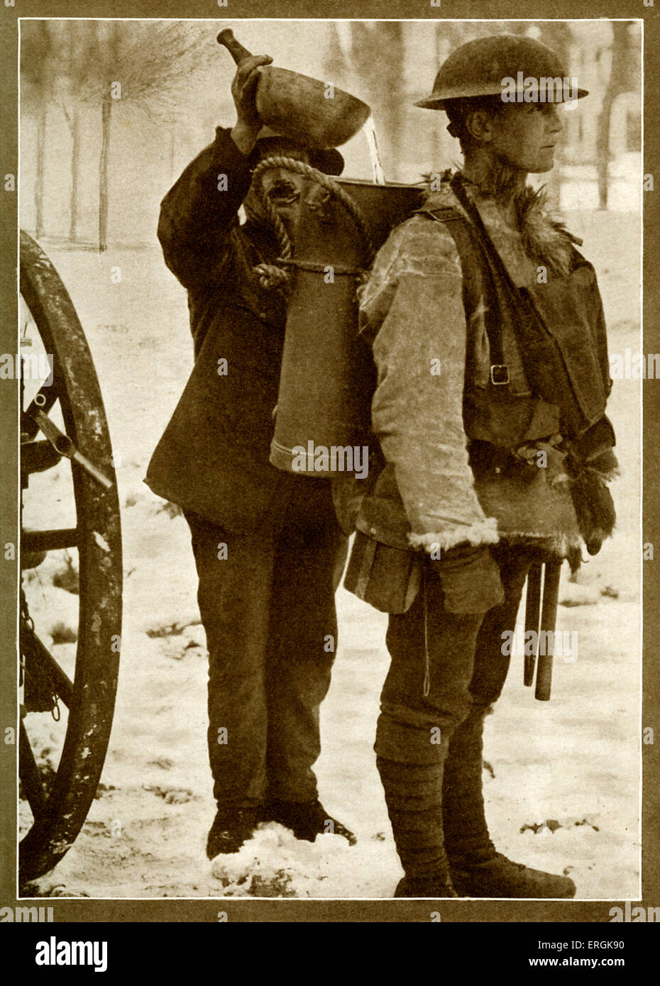 World War I - British soldier from infantry supply unit in winter snow, with a soup container strapped to his back to supply Stock Photo