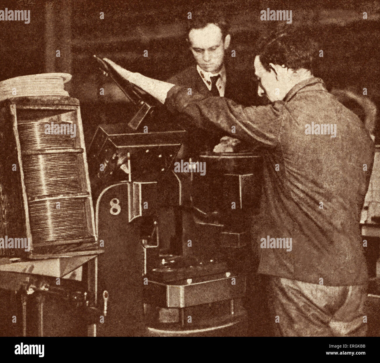 Machine pressing 'His Master's Voice' gramophone records, c.1920. Stock Photo