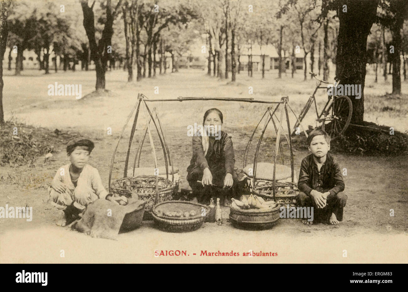 Itinerant merchants, Saigon, south Vietnam (now Ho Chi Minh City). Postcard after photograph, 20th century. Stock Photo