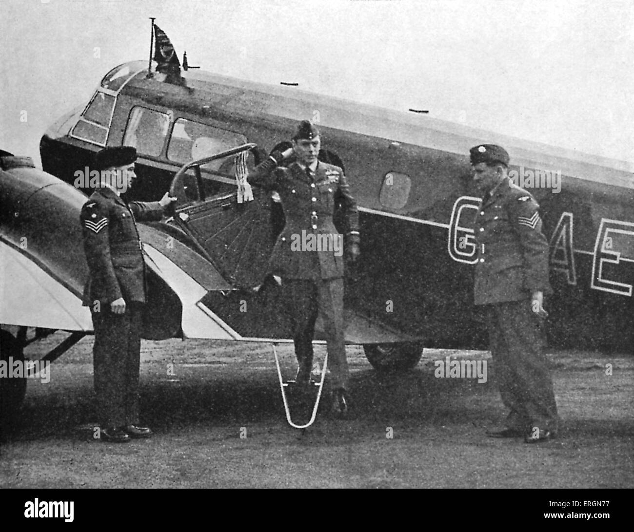 WW2 - King George VI disembarking from a plane at an R.A.F station. Stock Photo