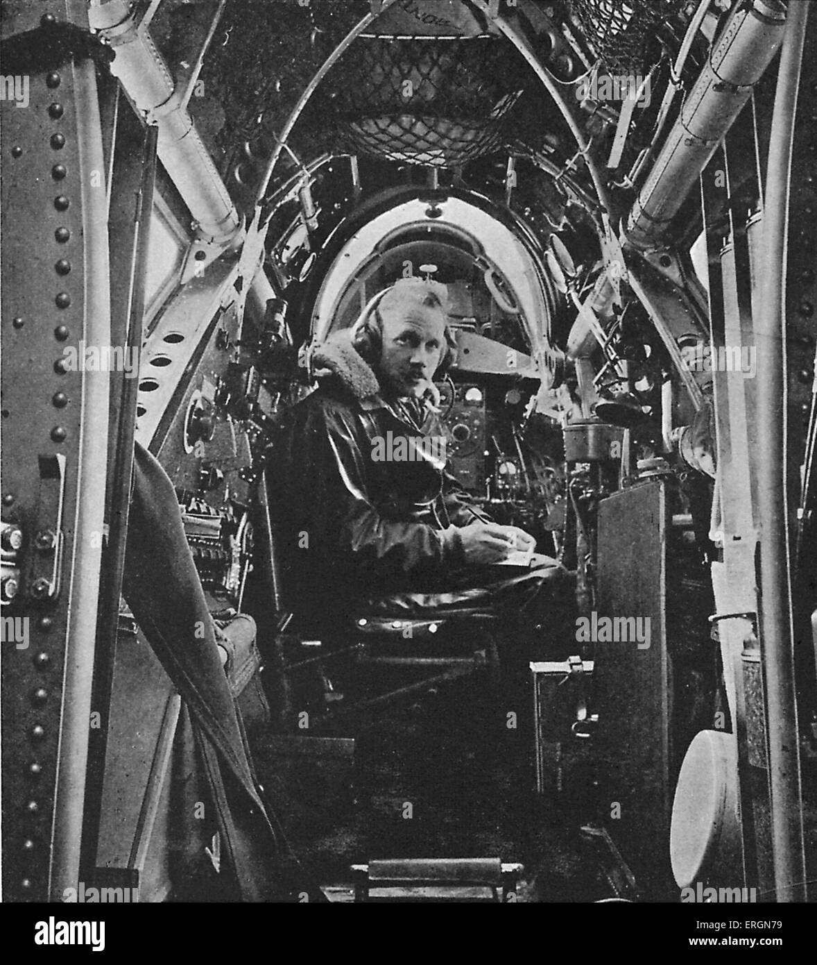 WW2 - RAF wireless operator on board a Vickers Wellesley bomber. Caption reads: The Wireless operator. At work inside a Vickers Stock Photo