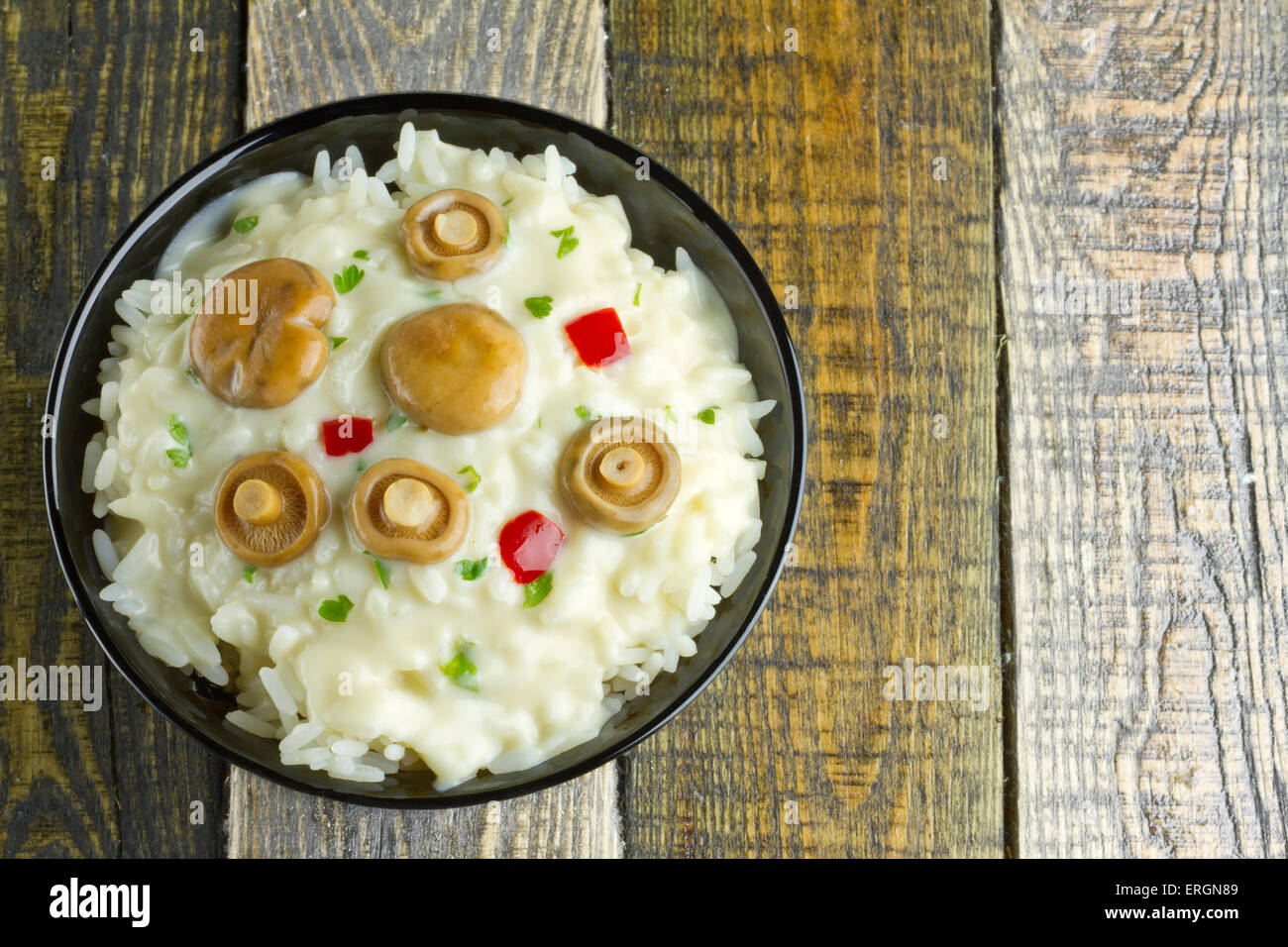 Saffron Milk Cap mushroom rice with white wine sauce on a bowl on
