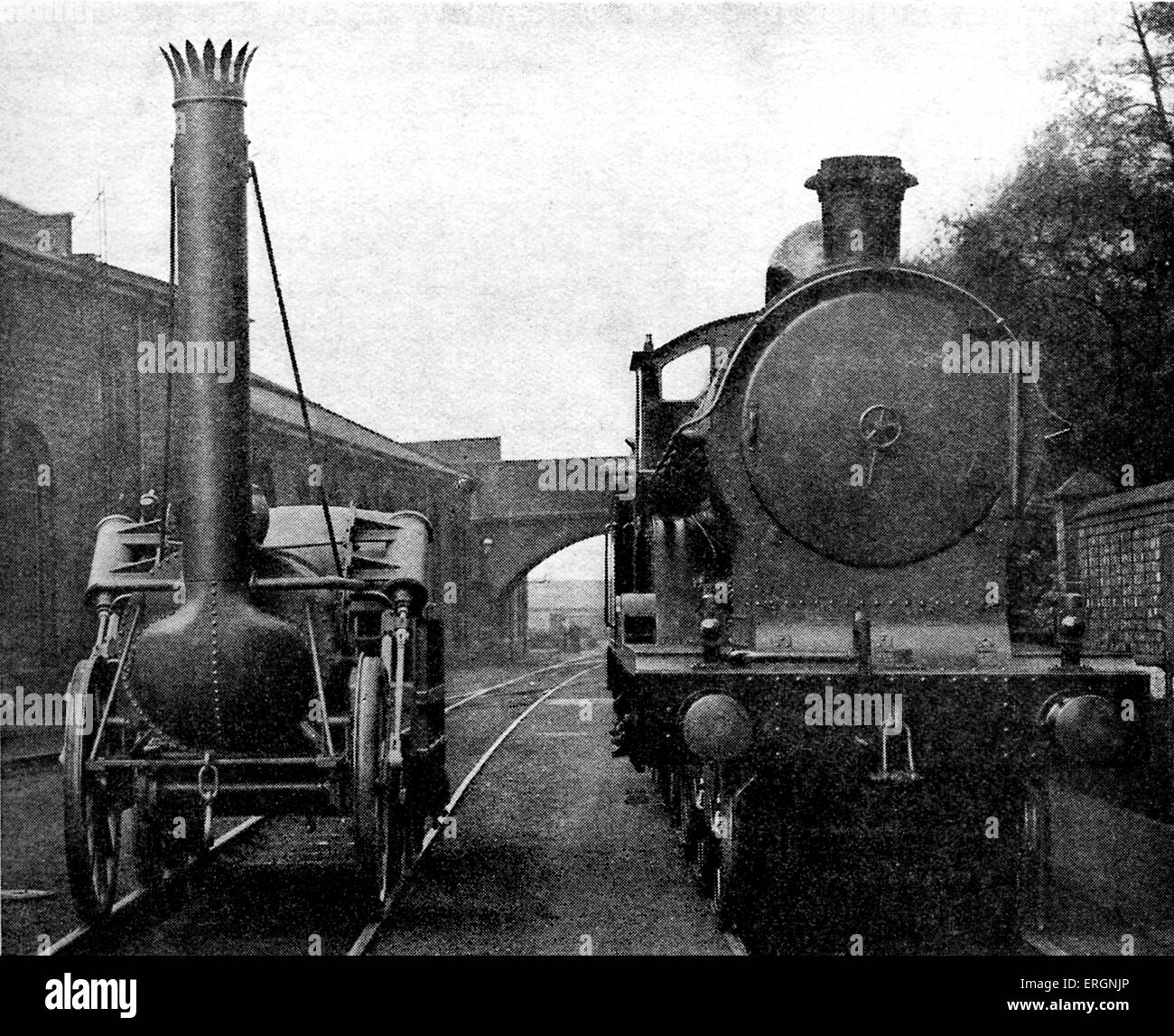 Stephenson's Rocket . Photo shows a full size model of Robert  Stephenson's Rocket alongside an engine of the George the Fifth Stock Photo