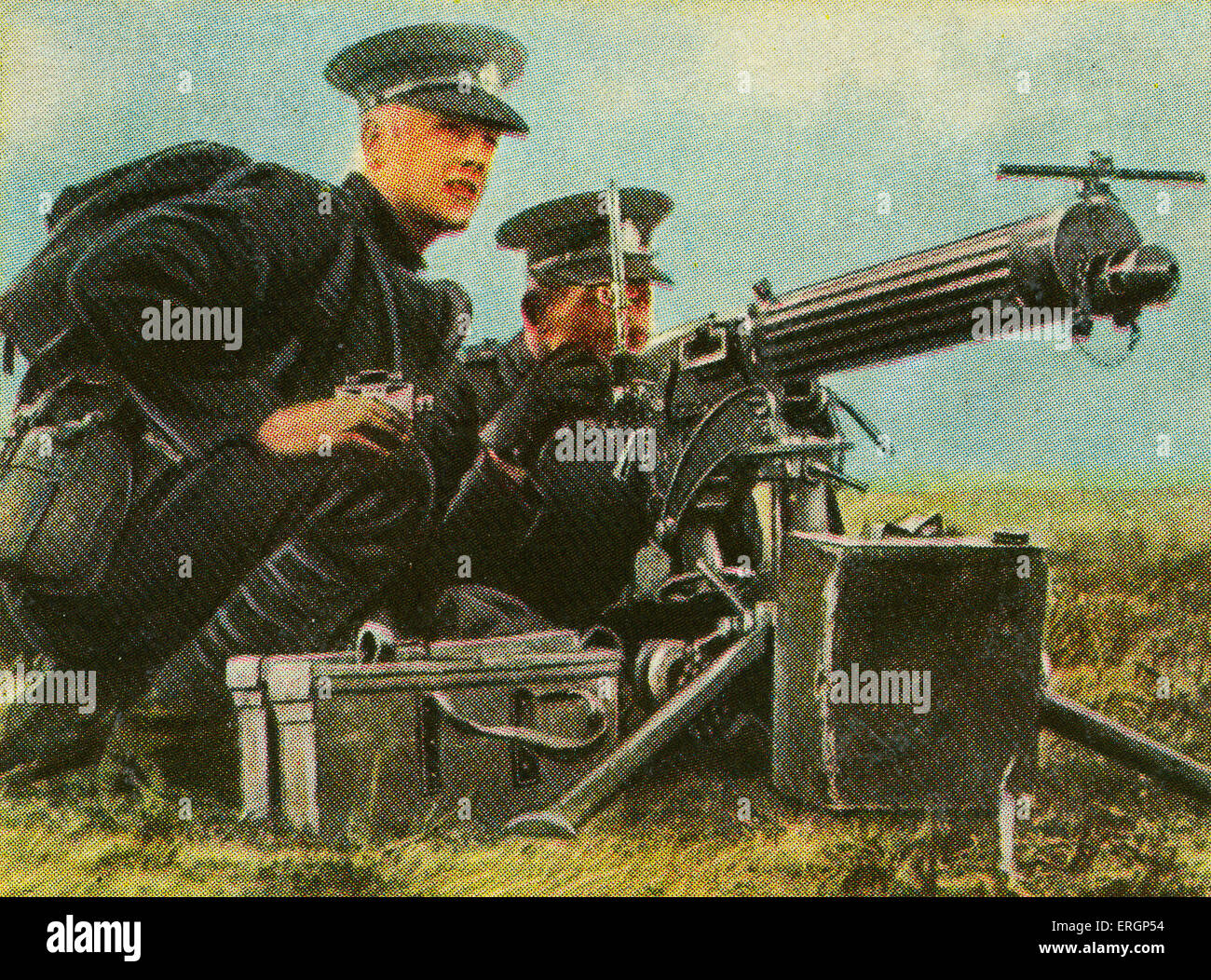 English heavy machine gun with British soldiers. Capacity was 900-1000 shots per minute. Needed to be operated by more than one soldier. (Source: Cigarette cards published in Germany c.1934 reviewing military equipment in arms race prior to WW2) Stock Photo
