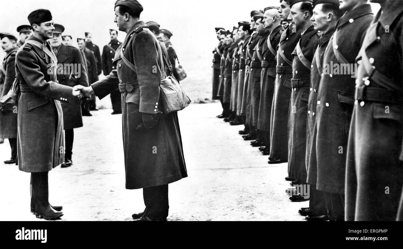 WW2 - King George VI meets members of the RAF.  Caption reads: ' Officers and men being presented to the King when His Majesty Stock Photo