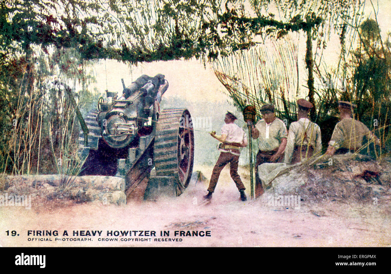 WW1 -  British artillery soldiers firing a Heavy Howitzer, a Western Front, France. Caption reads: 'One of the earth-shaking Stock Photo