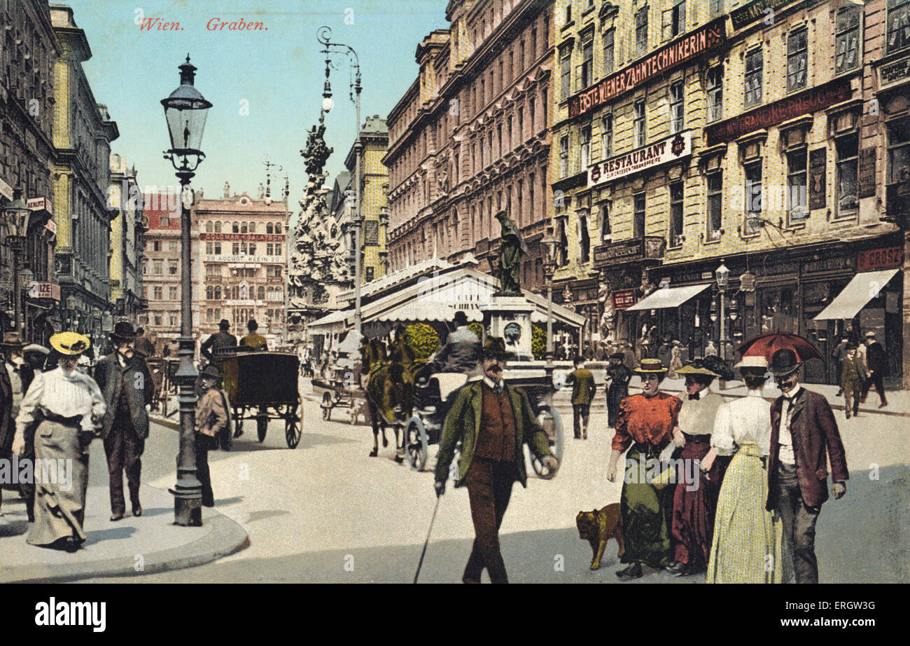Vienna, Graben -famous  street in city centre with people strolling. horse drawn cart, people strolling in summer, dog. Stock Photo
