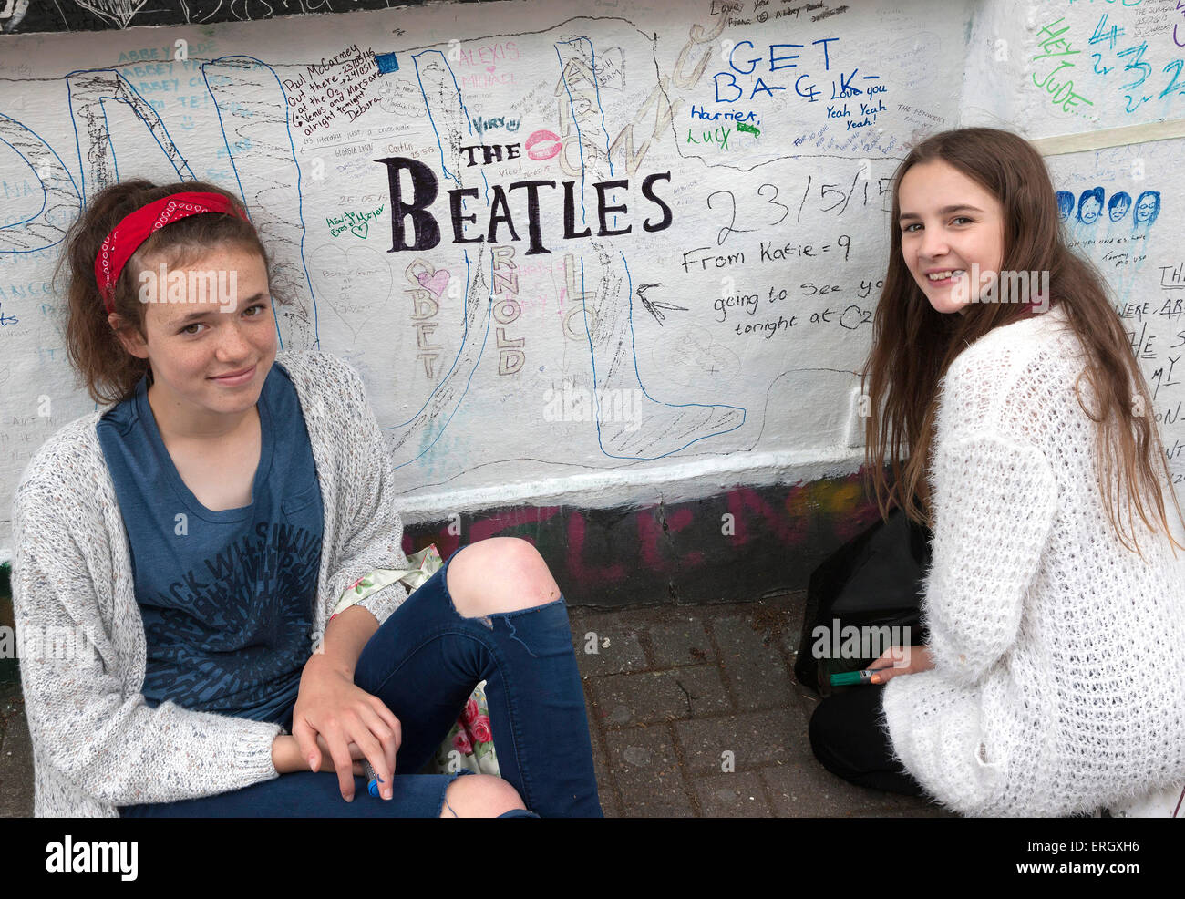 Beatles fans writing on wall at Abbey Road studios Stock Photo