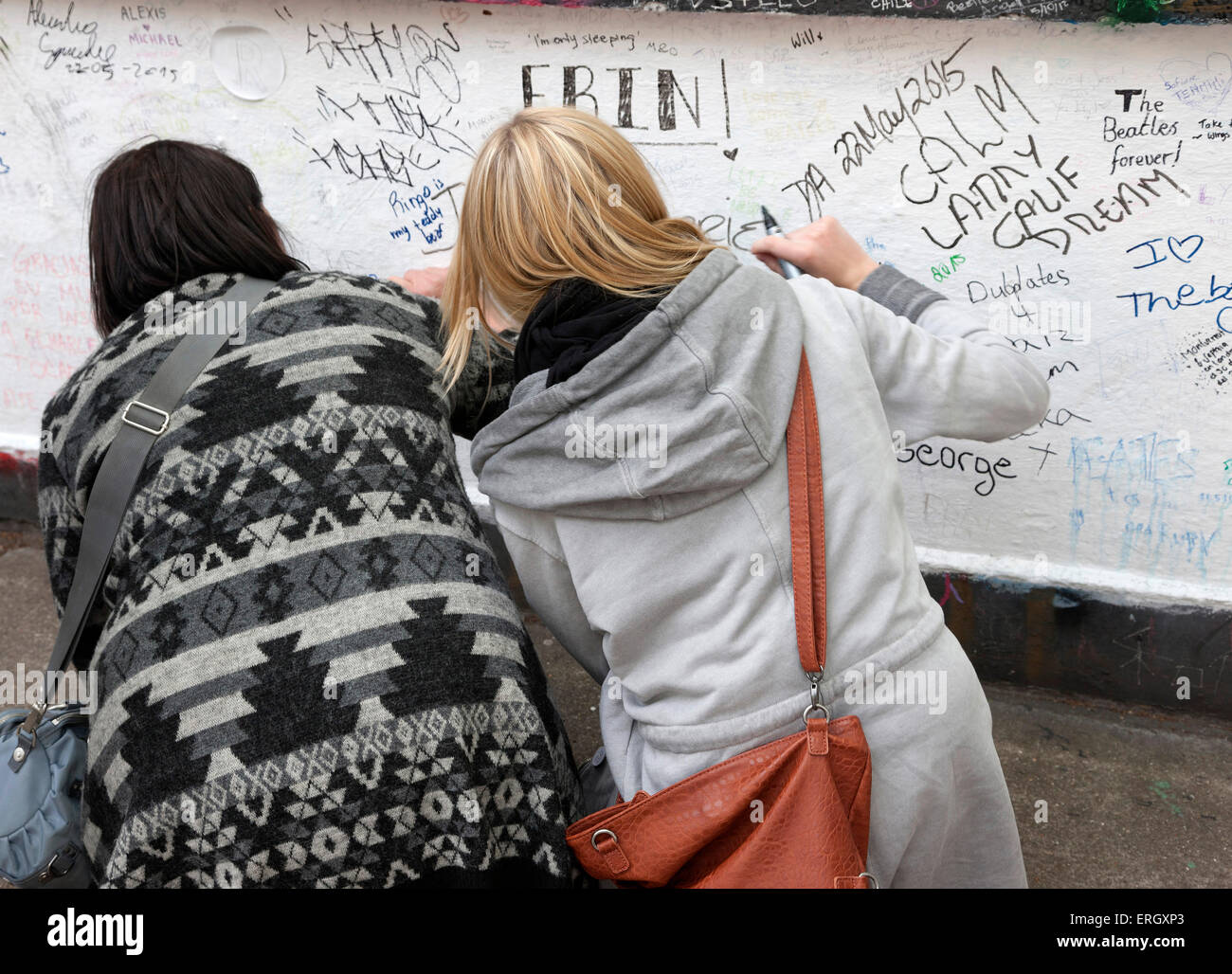 Beatles fans writing on wall at Abbey Road studios Stock Photo
