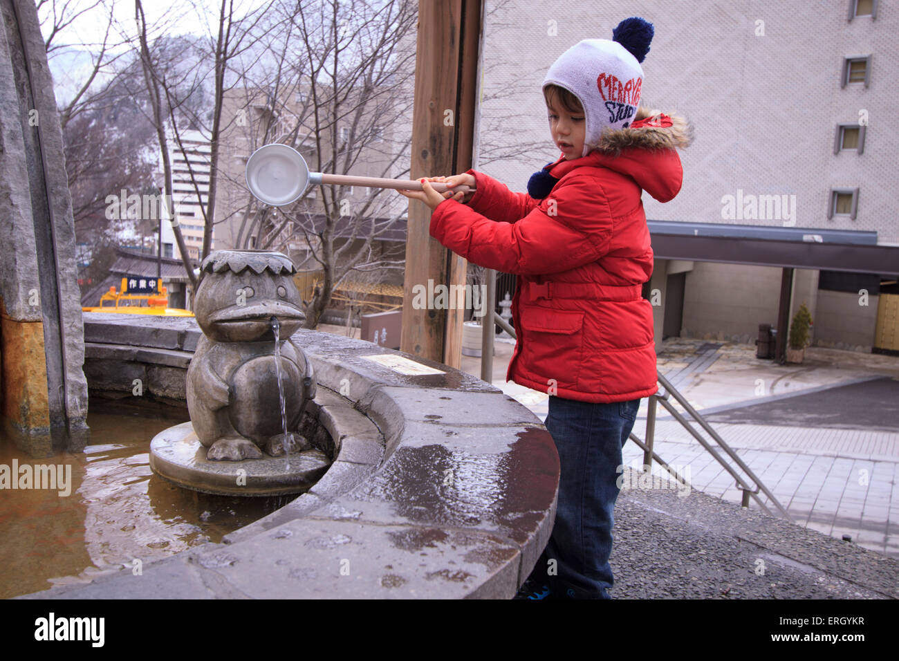 A young boy pours water to spill out of the mouth of a Kappa, water spirit,  statue in Jozakei, Sapporo, Hokkaido, Japan Stock Photo - Alamy