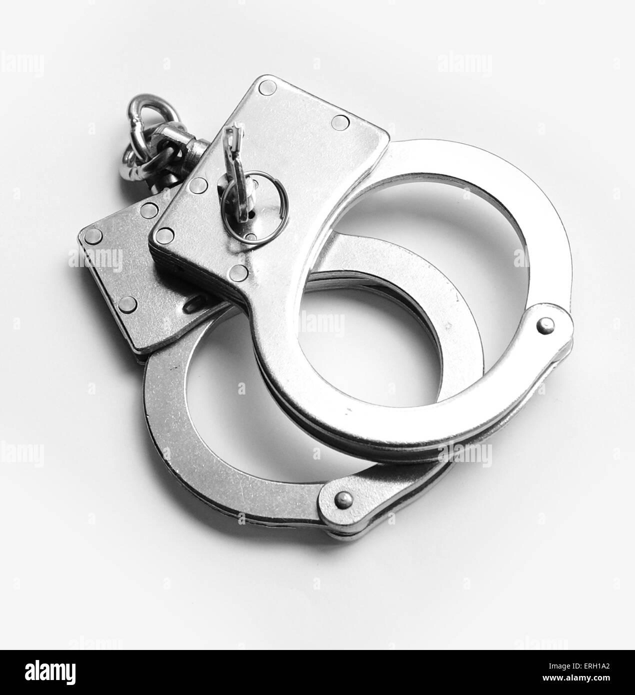 hand cuffs captures criminal who breaking law Stock Photo