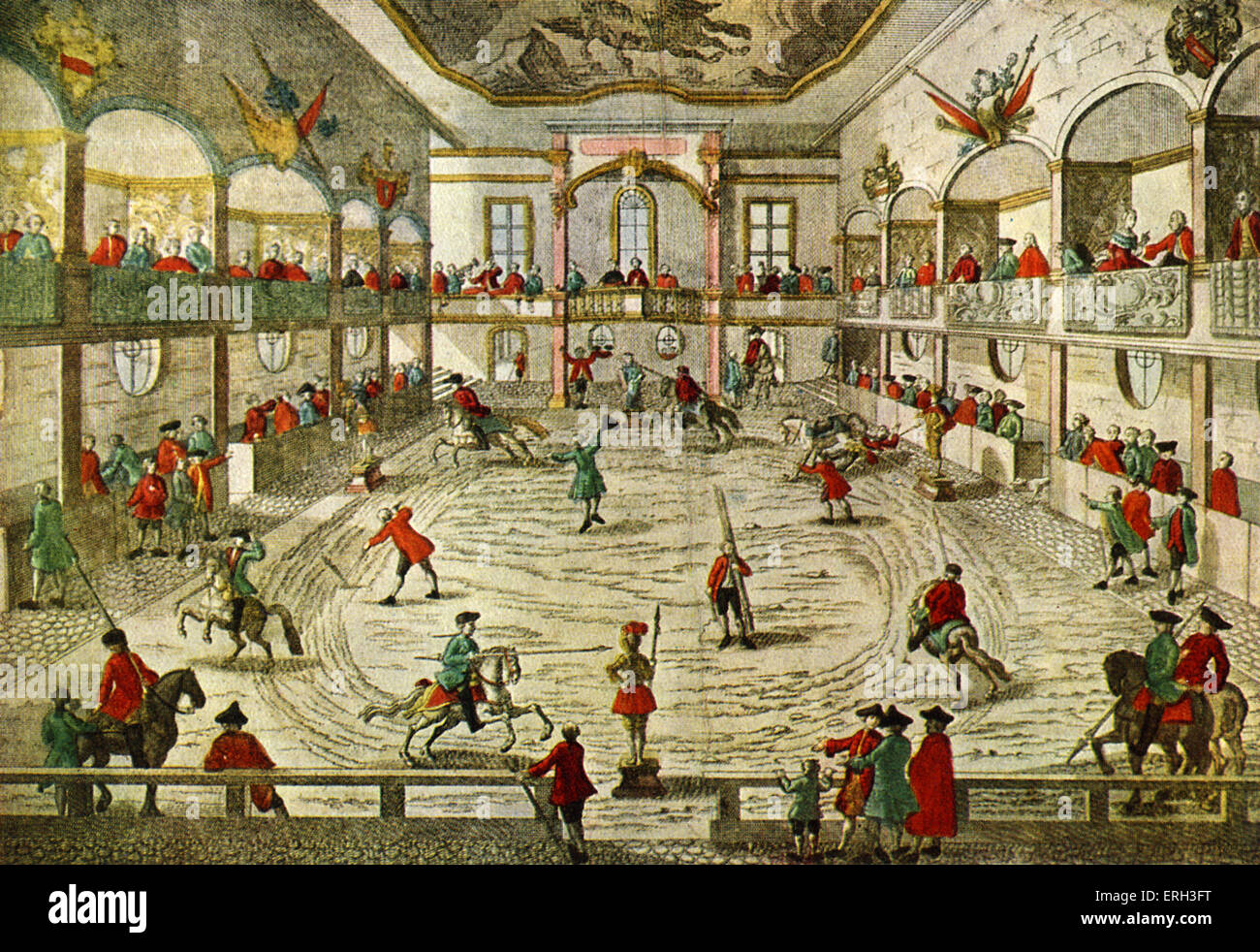 An 18th century horse  riding school, showing the transition to the circus ring. ( riding practice is being observed).  Hand Stock Photo