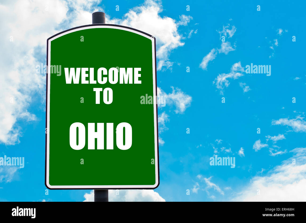Green road sign with greeting message to OHIO isolated over