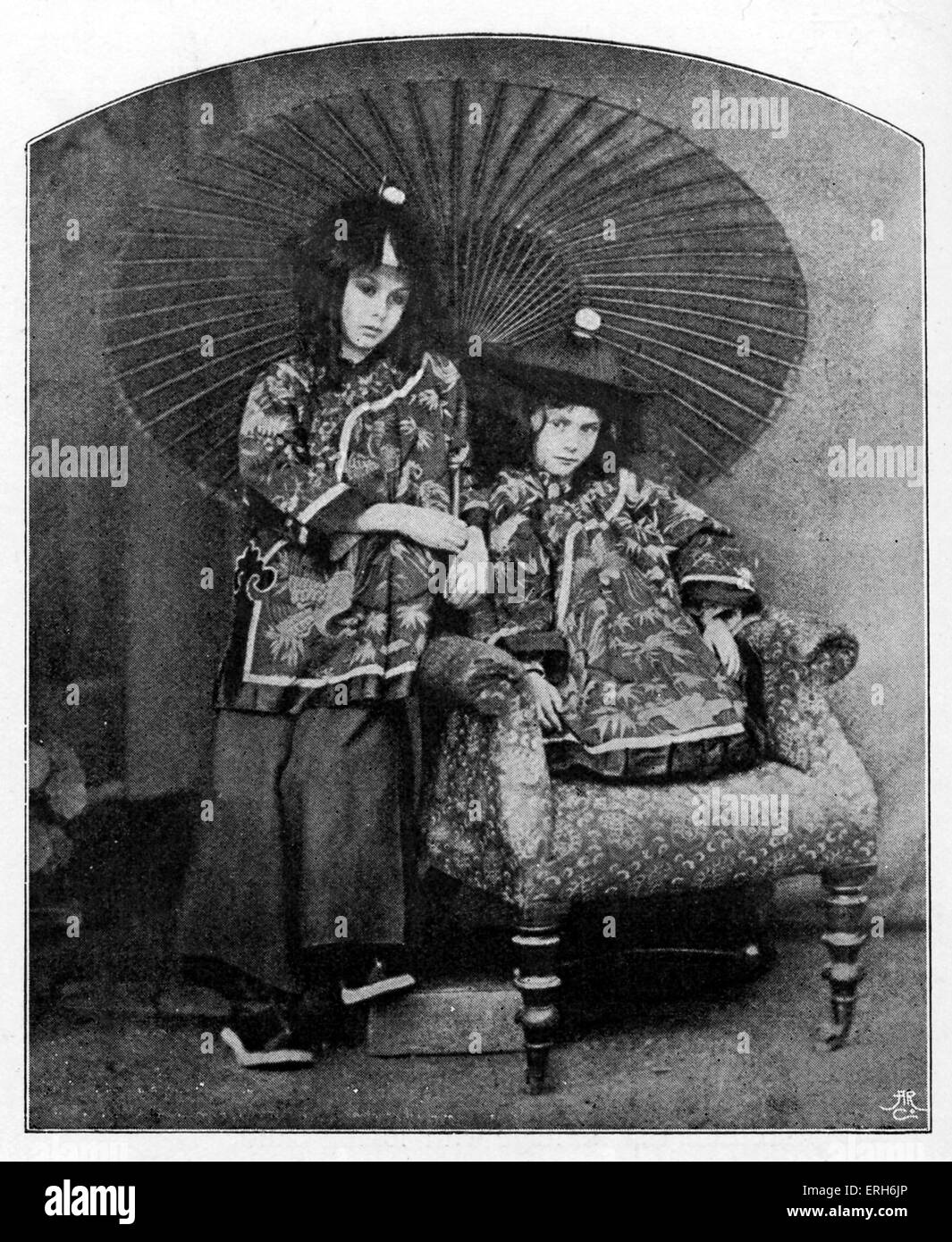 Liddell children -  photograph taken by Lewis Carroll. From left: Lorina and Alice Liddell in 'Chinese' costume.  Children of Stock Photo