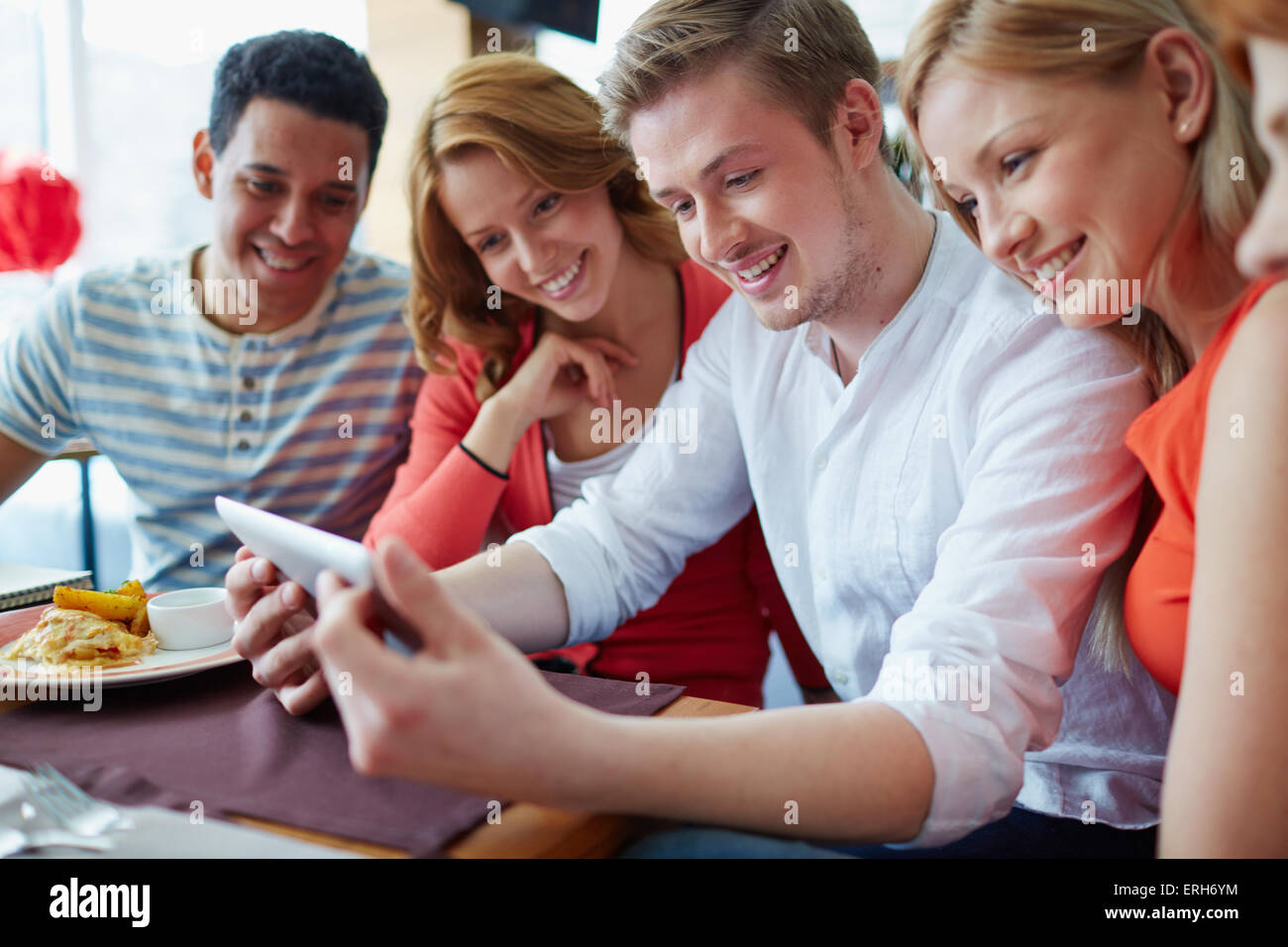 Modern teens using modern gadget Stock Photo - Alamy