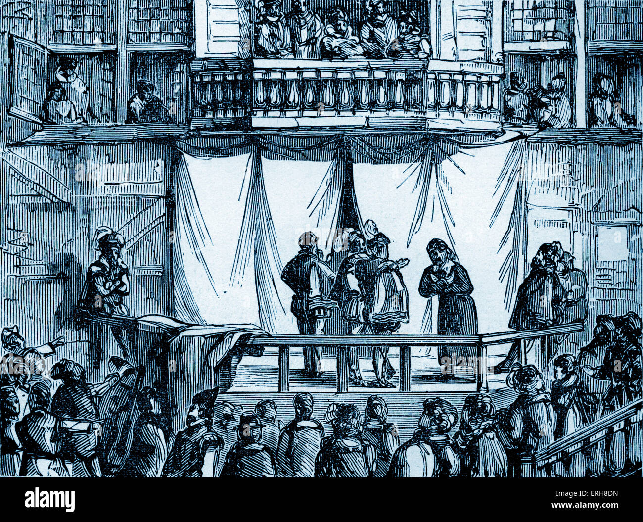 History of British theatre:  early  playhouse from 1570 - 1629 . Early English Elizabethan theatres . Note audience standing Stock Photo