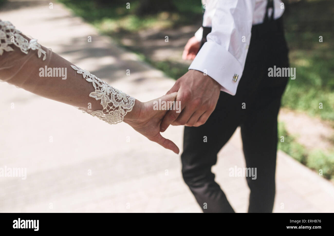 Bride and groom in the park Stock Photo - Alamy