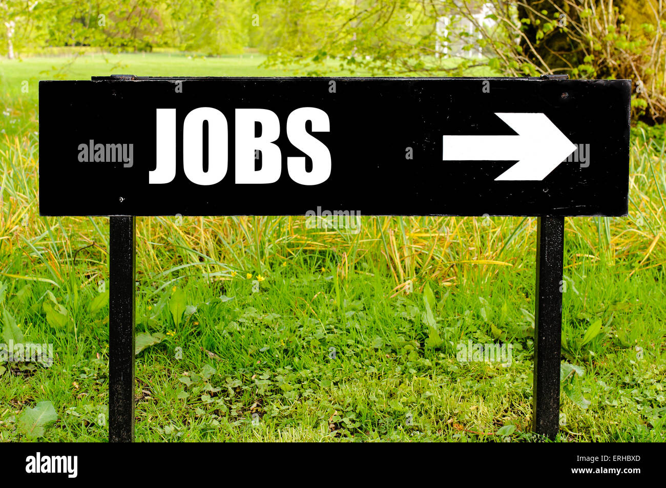 JOBS written on directional black metal sign with arrow pointing to the ...
