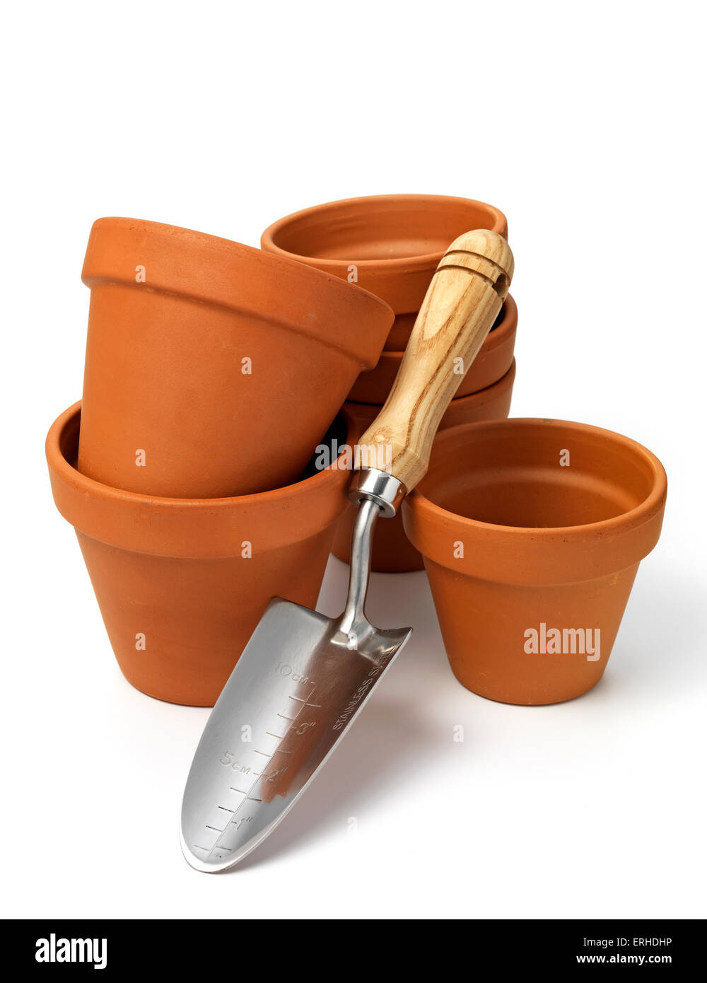 group of gardening pots with a gardening trowel Stock Photo