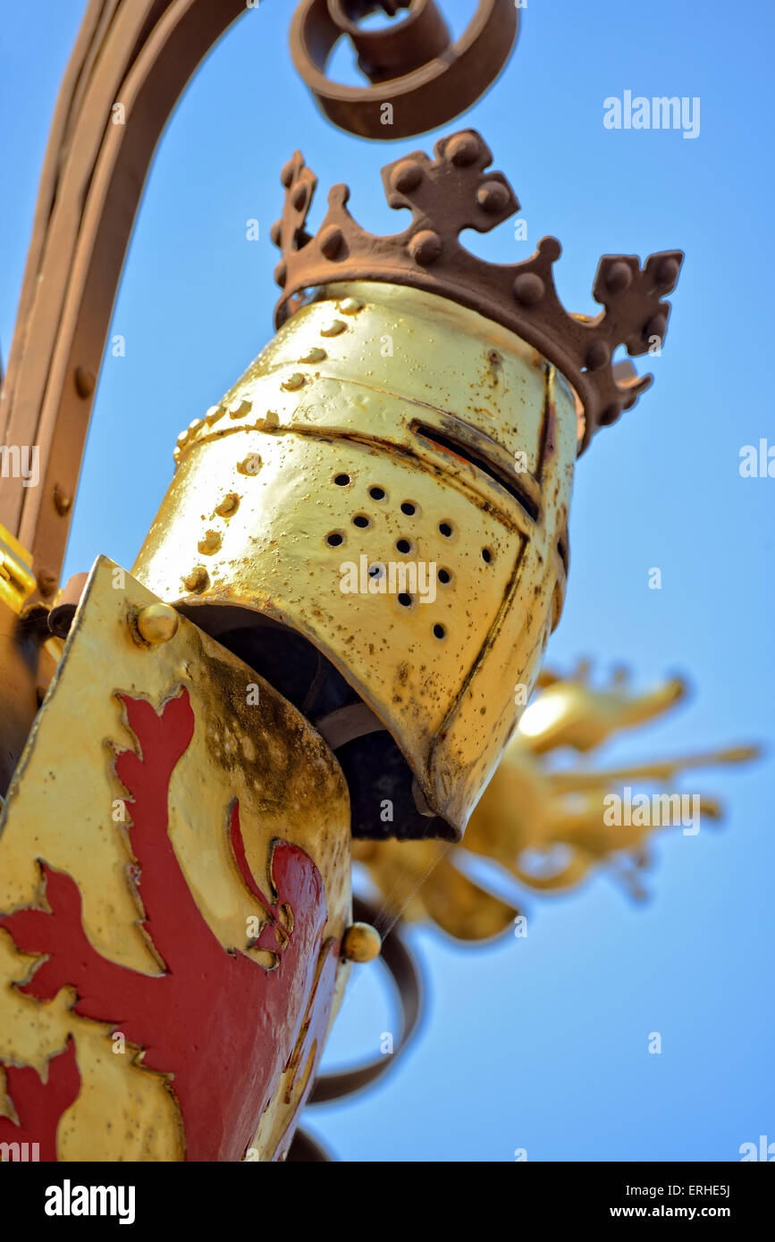 Attributes of knights decorating medieval fountain in historical center of Hague, Netherlands in clear sunny day Stock Photo