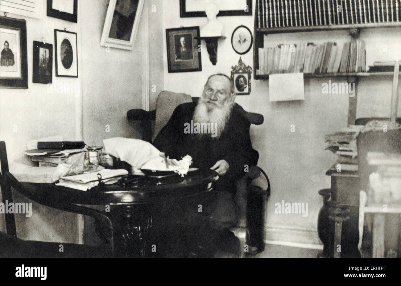 Leo Tolstoy - portrait of the Russian writer sitting at a table. 1828-1910. Stock Photo