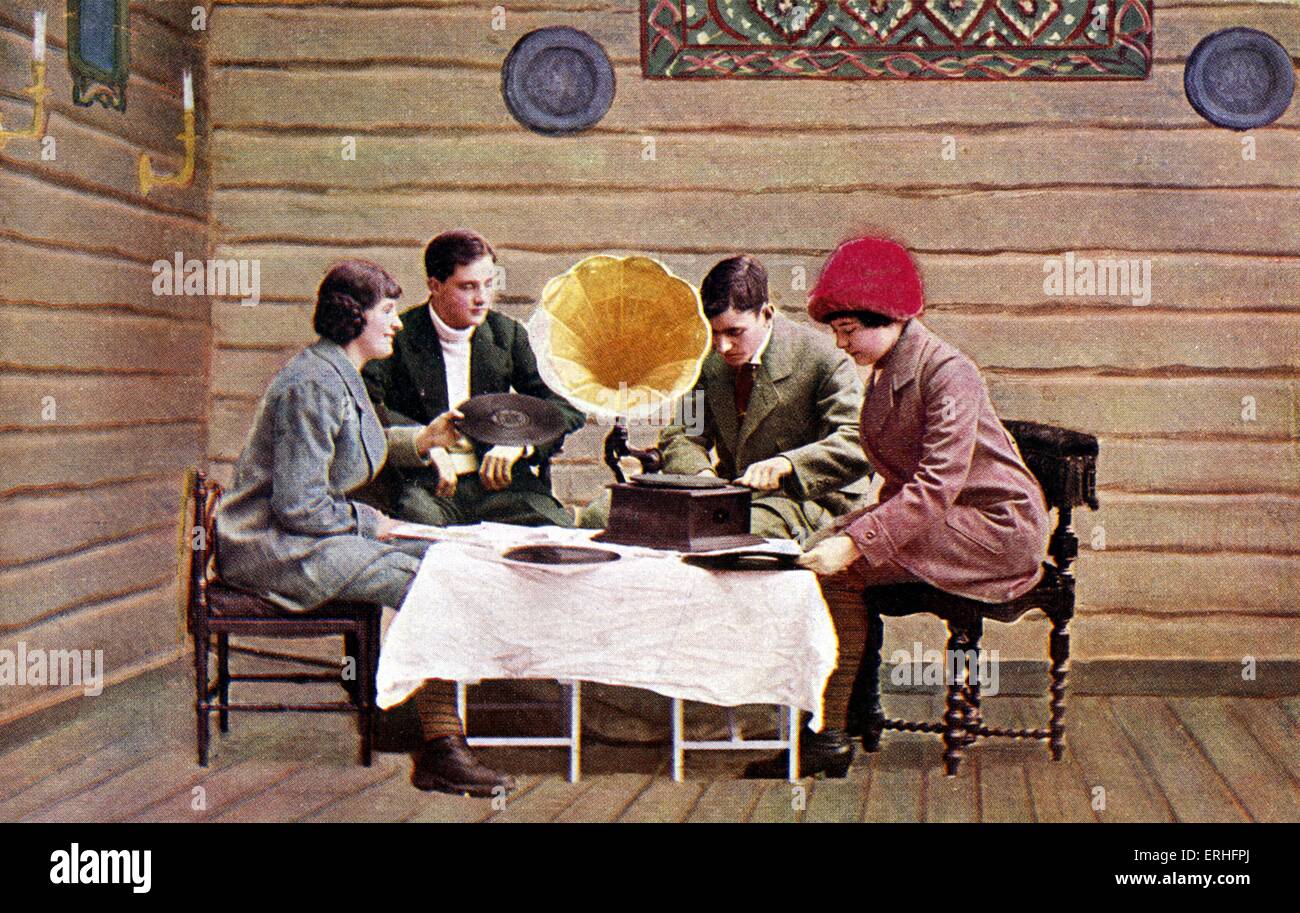Early gramophone in photo on Norwegian postcard of young people listening to record playing, early thirties. Stock Photo