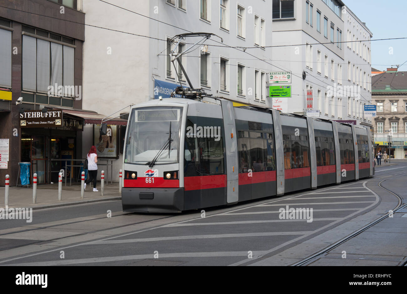 A Weiner Linen Seimens built ultra low floor 7 section tram arrives at Florisdorf station on route 26. Stock Photo