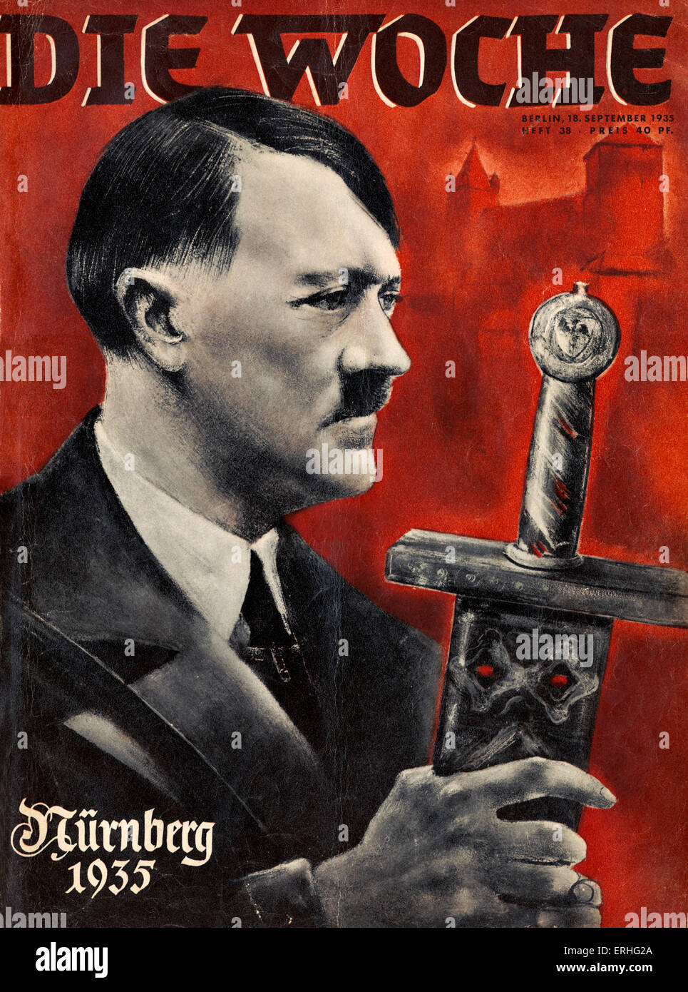 Hitler with ceremonial sword on cover of  Nuremberg rally issue of Die Woche.    Nurnberg 1935 is written on cover. Wagner link Stock Photo